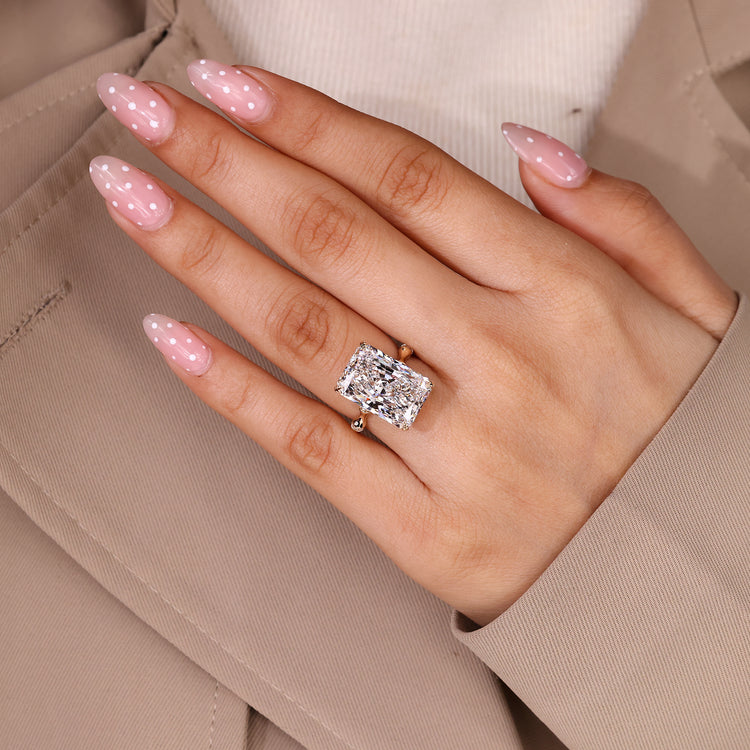 Radiant Cut Diamond Ring with round pave diamonds.
