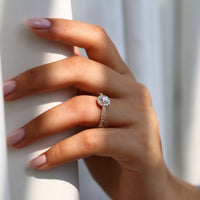 Handmade yellow gold engagement ring with halo setting.
