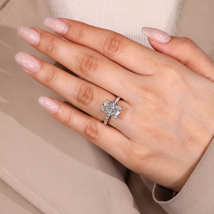 Four claw prong elongated cushion diamond ring.
