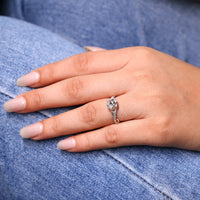 Round Cut Diamond Ring with 4 prong and twisted band.
