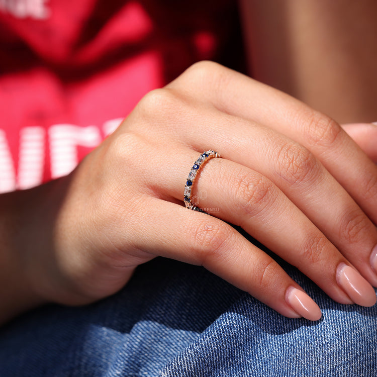 Emerald and round diamond wedding band.