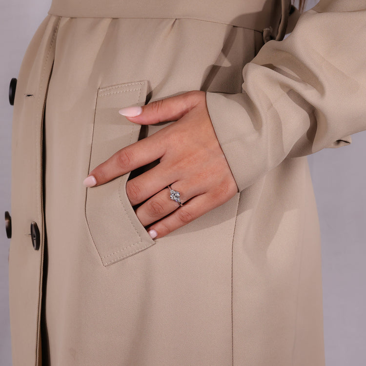 Handmade ring with round cut side stone.
