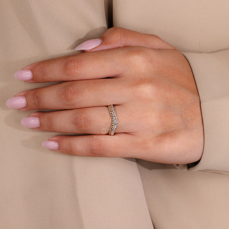 Prong setting and unique wedding band for her.