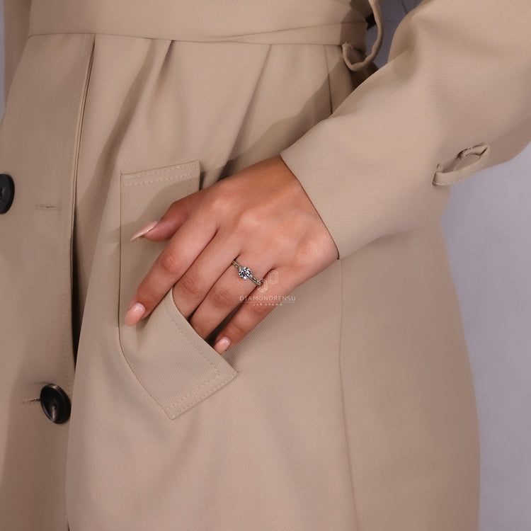 Stunning two-tone engagement ring featuring green diamond accents.
