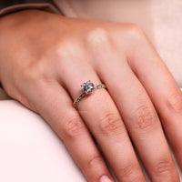 Round diamond eternity ring with elegant 4-prong setting.

