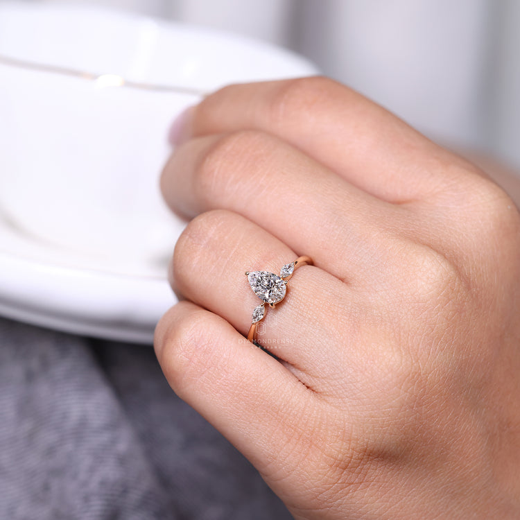 Lab grown pear cut diamond ring with tapered shank.
