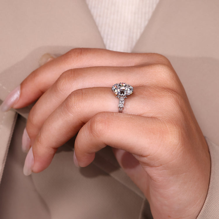 Cushion Old European Cut Ring fish tail prong style.
