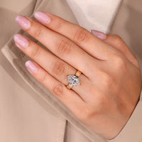 Solitaire diamond ring with four claw prong setting.
