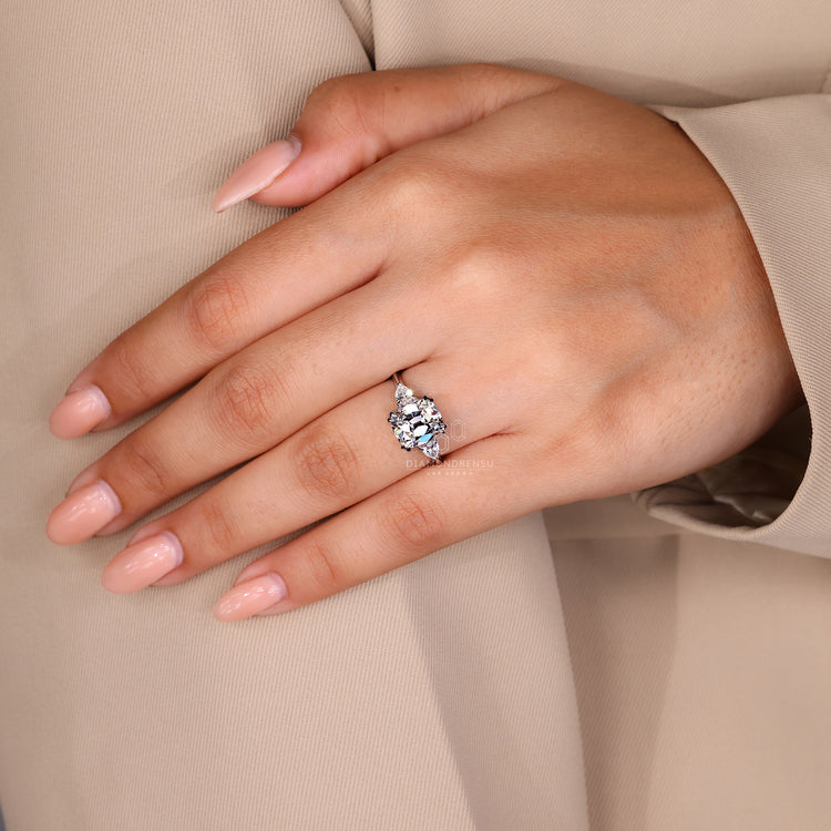 Handmade three stone Cushion Old European Cut ring.
