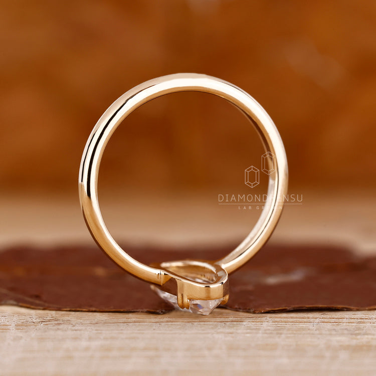 Moval rose diamond ring double claw prong solitaire.
