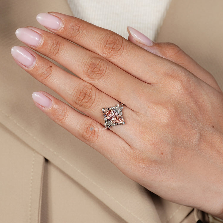 Marquise diamond ring with round diamond side stones.