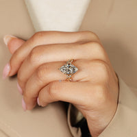 Marquise ring with six leaf style prongs.