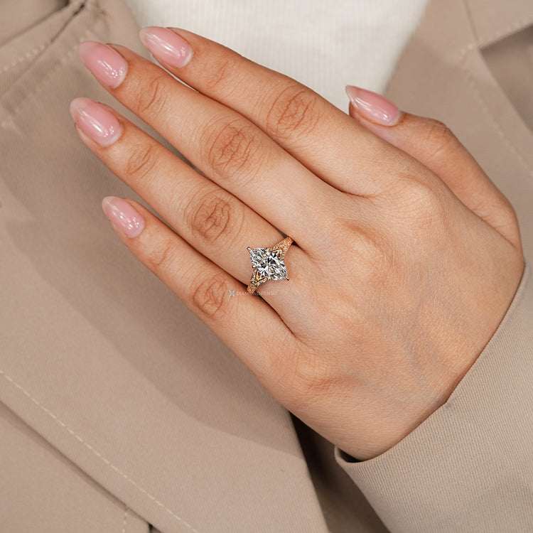Lab grown marquise diamond ring with six claw prongs.