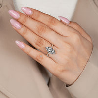 Marquise diamond ring with two tone setting.