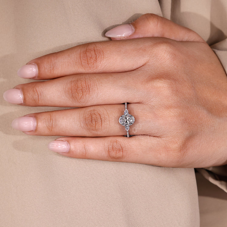 Cathedral setting oval cut diamond ring with halo.

