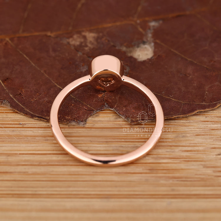 IGI certified round diamond bezel solitaire ring.
