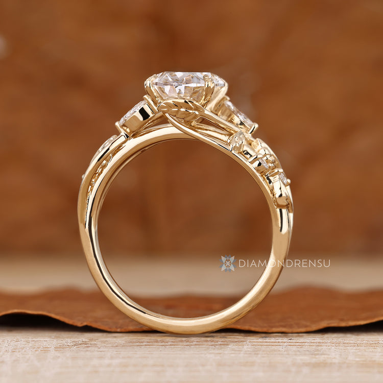 Handmade oval diamond ring marquise side stones.