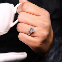Coffin cut ring think "Leaf" prong and twisted shank style.