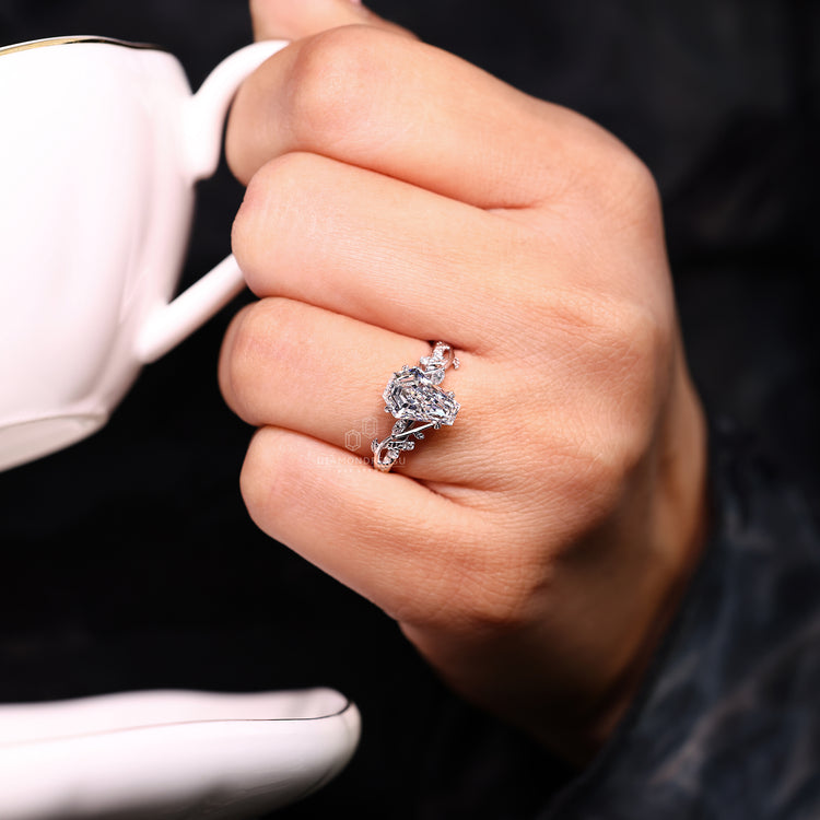 Coffin cut ring think "Leaf" prong and twisted shank style.