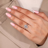 Coffin diamond ring round diamonds bezel set.