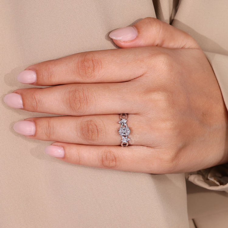 Lab grown diamond oval engagement ring with cluster design.
