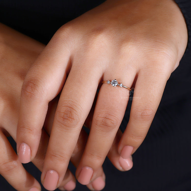 Handmade round cut diamond ring three stone design.