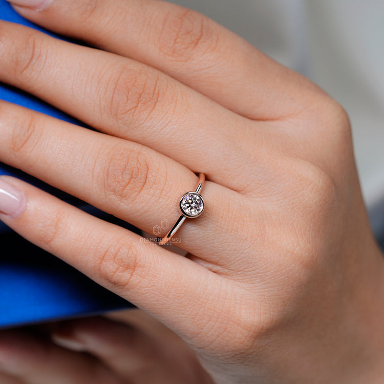 Bezel setting round diamond solitaire ring design.

