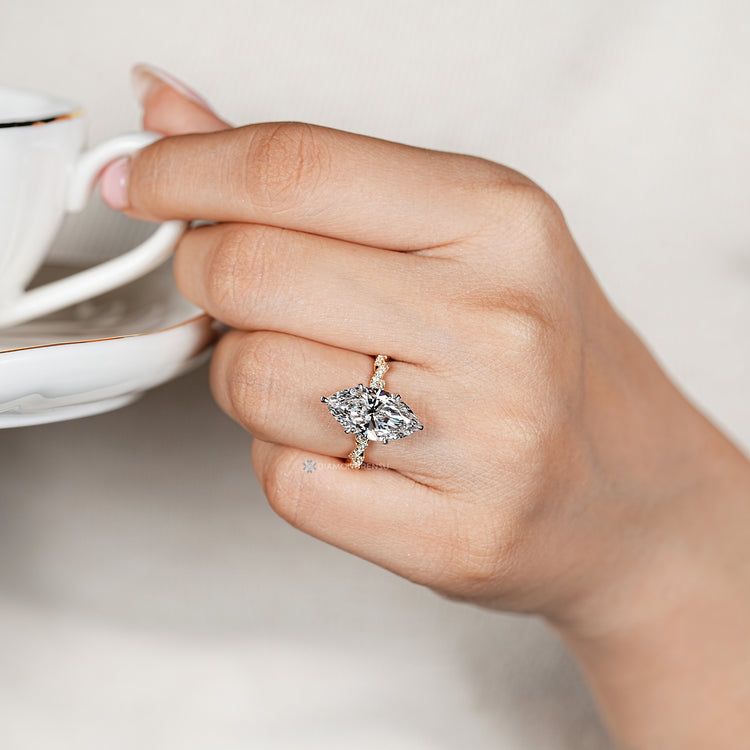 Marquise ring with six claw prong setting.