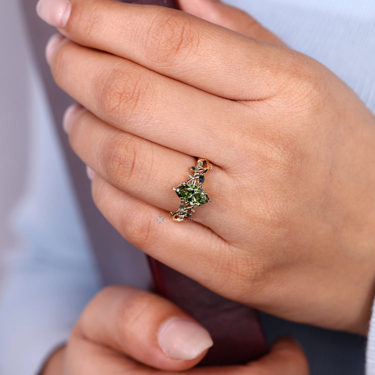Marquise cut ring with green diamond and moss agate.