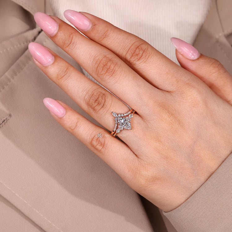 Lab grown marquise ring with round and marquise side stones.