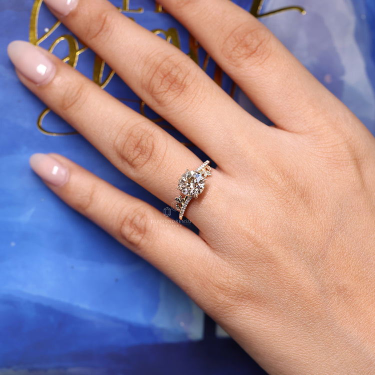 Round old cut diamond ring cathedral four claw set.
