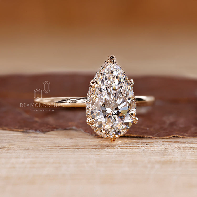 IGI certified hidden halo pear diamond ring.
