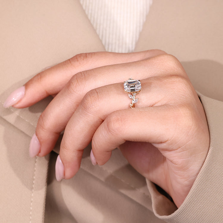 Lab grown diamond engagement ring with side stone detail.
