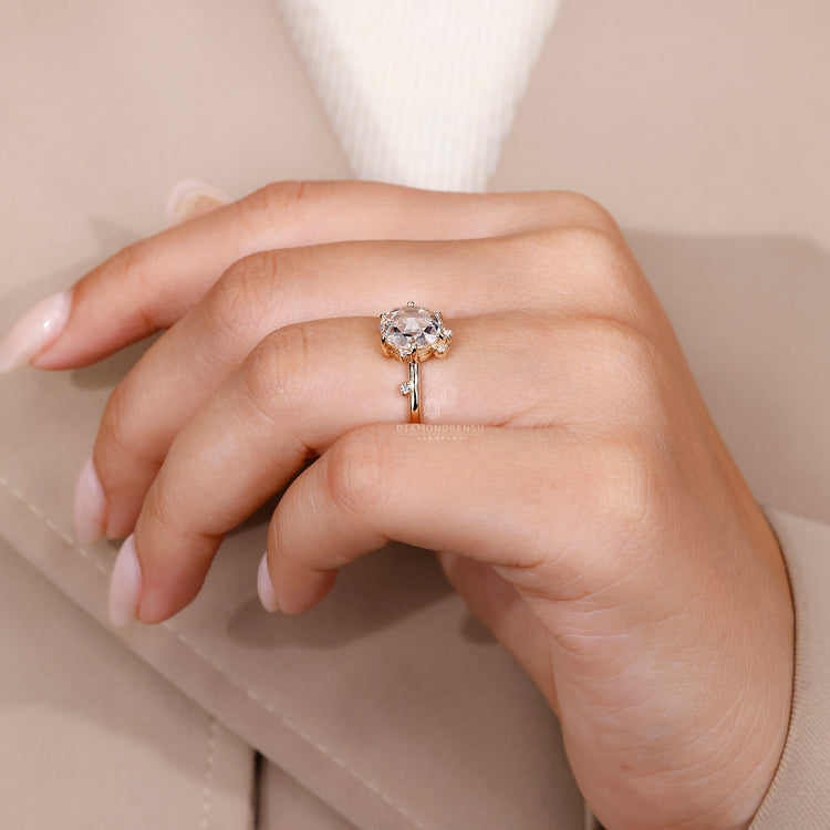 Round rose cut ring and round side stone.
