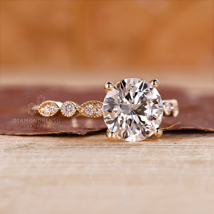 Designer round diamond engagement ring.
