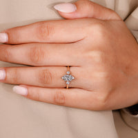 Hidden halo engagement ring with shared prong ring.
