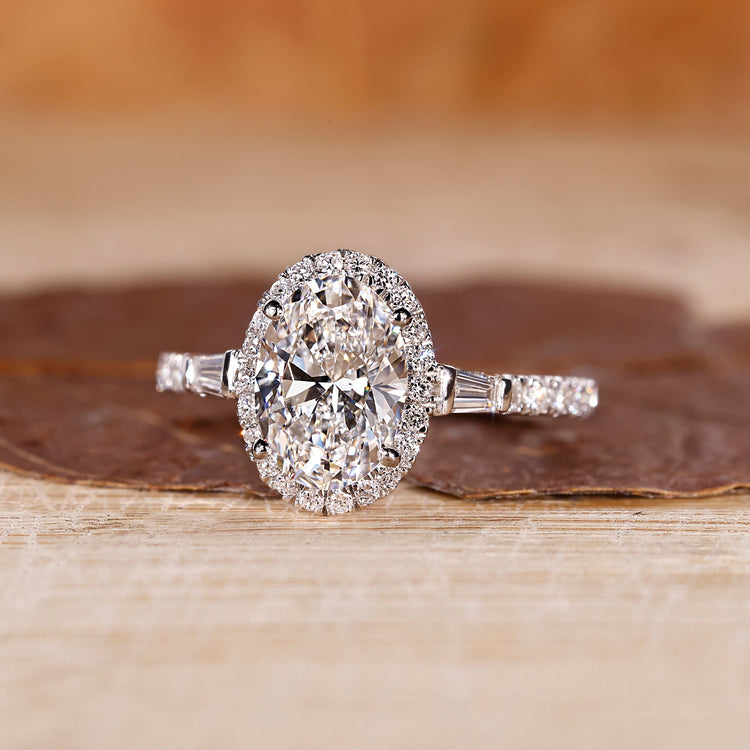 Oval shaped engagement ring with tapered baguette side stones.
