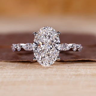 Oval diamond engagement ring with shared prong setting.
