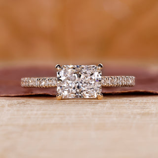 Radiant engagement ring with east to west setting.
