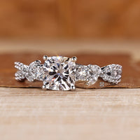 IGI certified cushion diamond ring four prong set.