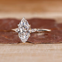 Lab grown marquise diamond ring three stone style.
