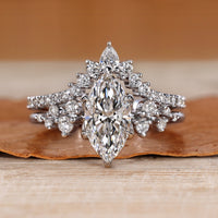 Marquise diamond bridal set with round side stones.