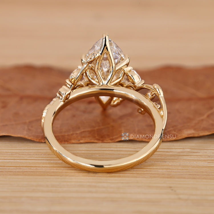 Handmade nature inspired marquise diamond ring.