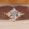 Marquise cut diamond ring with nature inspired design.
