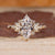 Marquise cut diamond ring with nature inspired design.
