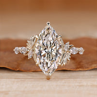Marquise cut diamond ring shared prong pave style