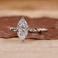 Lab grown marquise diamond ring twisted pave style.
