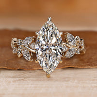 Marquise diamond ring with round and marquise side stones.