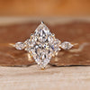 Marquise diamond ring with marquise and round side stones.
