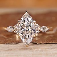Marquise diamond ring with marquise and round side stones.